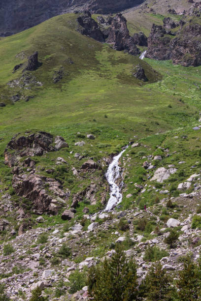 istock Terskol waterfall among the green mountain 1423161909