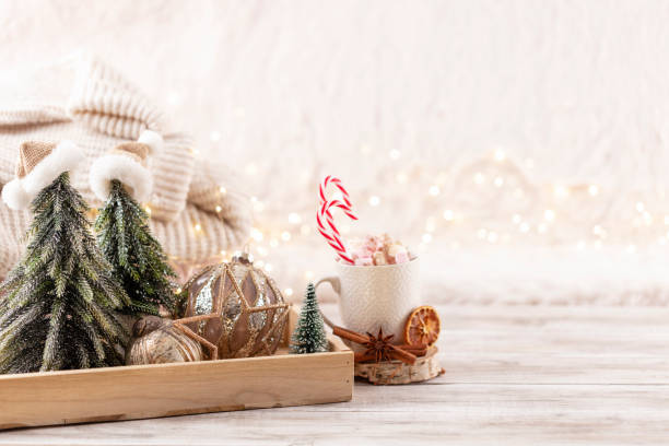 istock Cup with a hot drink, marshmallow on a table with christmas decorations. 1423162985