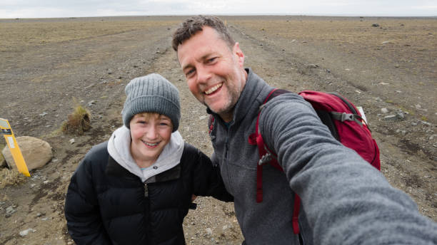 Father and Son Happy Selfie on an empty moonlike surface