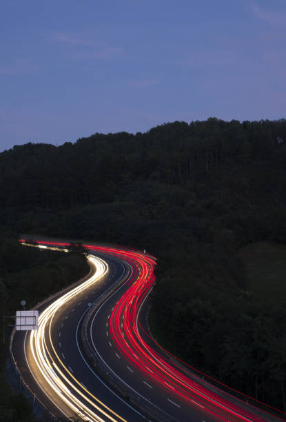 istock Car lights driving on the freeway at night 1423164327