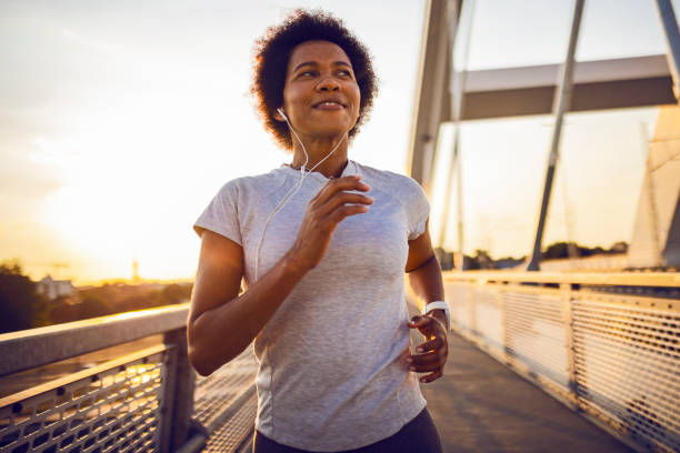 istock African woman running on the bridge 1423164425