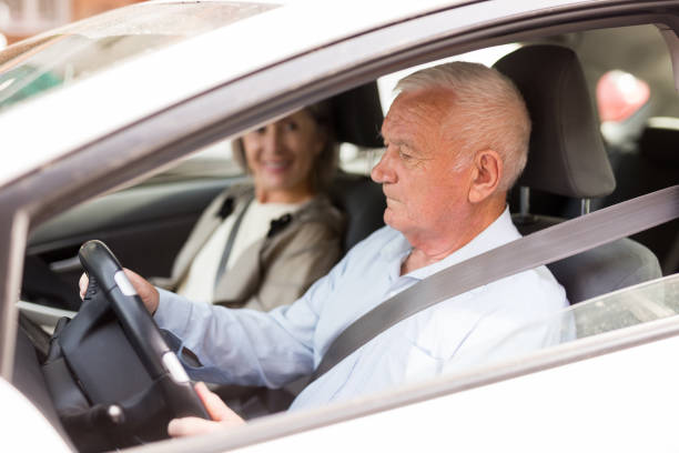 istock Senior couple sitting in car 1423164696