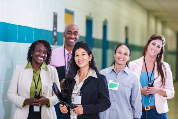 istock Hispanic woman leads school staff 1423165706