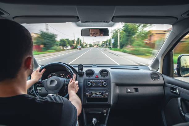istock Hands on the wheel when driving at high speed from inside the car. 1423166789
