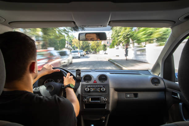 istock Hands on the wheel when driving at high speed from inside the car. 1423166798