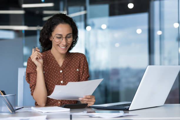 istock Young beautiful Arabic business woman working in modern office with documents 1423167294