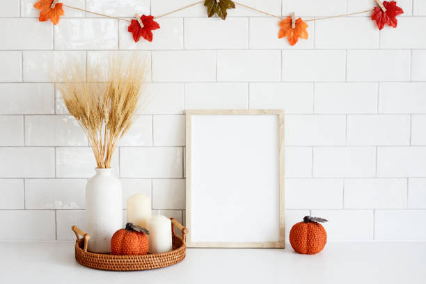 istock Picture frame mockup with autumn fall decorations on tile wall background. Thanksgiving, Halloween holiday poster design. 1423167752