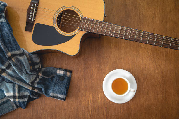 istock Music background with acoustic guitar, top view. 1423168783