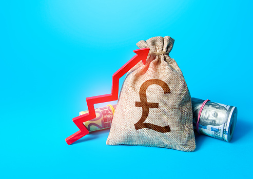 British pound sterling money bag and red up arrow. Rise in profits. Increase in the deposit rate. Increase income and business efficiency. Inflation acceleration. Investments. Economic growth, GDP.