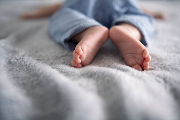 istock Cute little baby feet. 1423171697