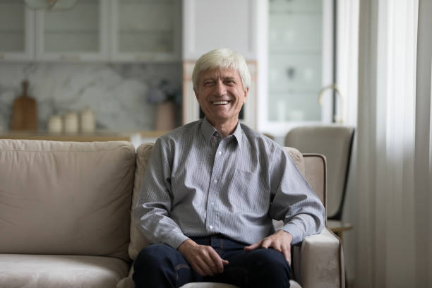istock Happy senior elder 60s man indoor home portrait 1423172473