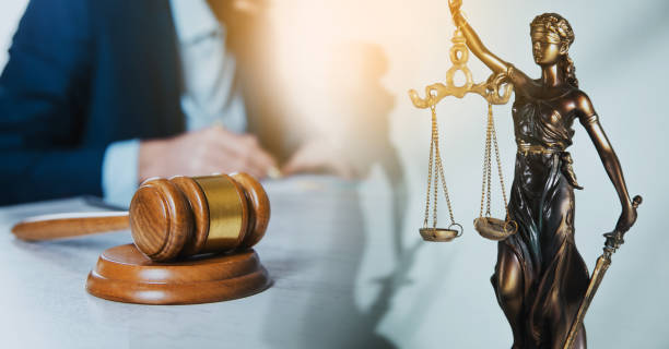 istock man working with justice lady and judge on desk 1423172663