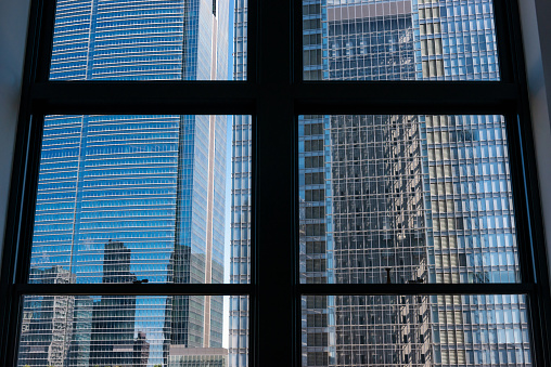 Skyscrapers seen through the window, urban landscape.