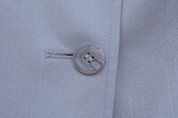 istock clothing made of fabric and one big gray plastic button 1423177187