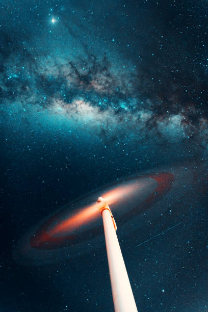 istock night sky over a spinning wind turbine, long exposure 1423177266