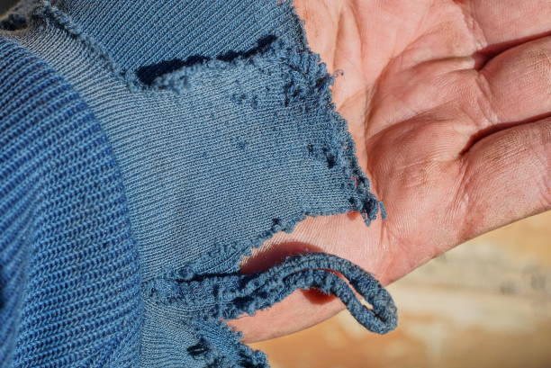 istock old one torn blue sleeve made of fabric on clothes 1423177312