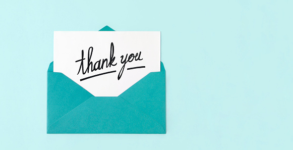 Handwriting Thank you note in blue envelope