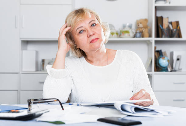 istock Woman engaged in home accounting 1423180414