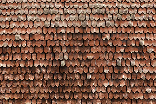 Wood shingles on the roof of an old German barn.