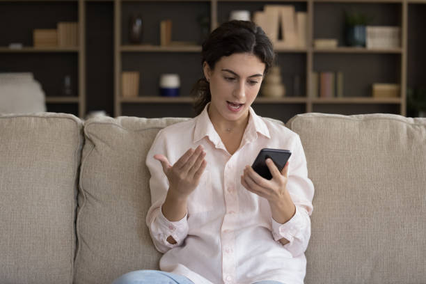 istock Young woman feels dissatisfied faced with smartphone work problem 1423181600