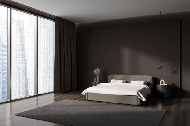 istock Corner view on dark bedroom interior with empty brown wall 1423187114