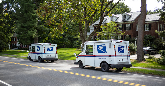 Los Angeles, California, USA - September 4, 2020: A blue United States Postal Service box for depositing/sending mail on a quiet suburban street in the San Fernando Valley.