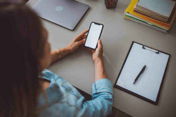 istock Woman at home office using smart phone 1423187804