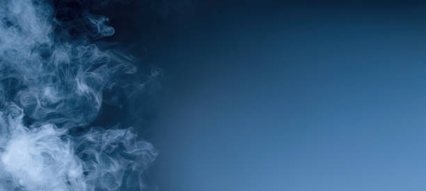istock Cloud of blue smoke. Abstract smoke wallpaper background for desktop Banner design with copyspace. 1423190103