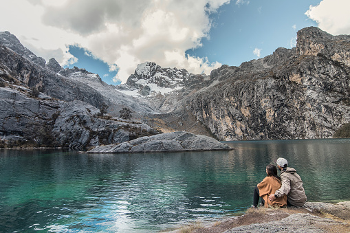 couple looking at a beautiful blue lake