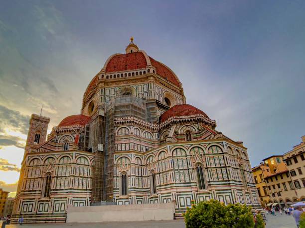 A view of Duomo cathederal made of marble and a major tourist attraction in Florence, Italy shot during sunset.