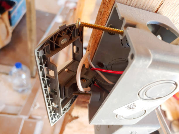 istock Installation of switch for house light with connected cables 1423206090