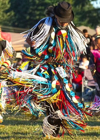 Post Falls, Idaho-July 14, 2009. A native American man in full dress dances at the Julyamsh powwow in northern Idaho