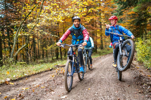 istock Friends cycling in nature, performing stunts 1423206976