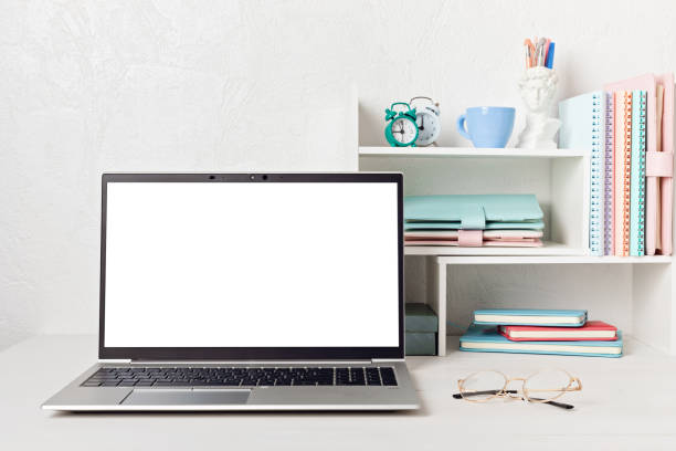 istock Empty laptop screen, desktop organizer with desk shelves and office supplies 1423207367