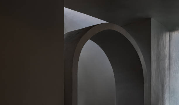 istock Sunlight shines through white arch interior design and white cement wall. 1423212602