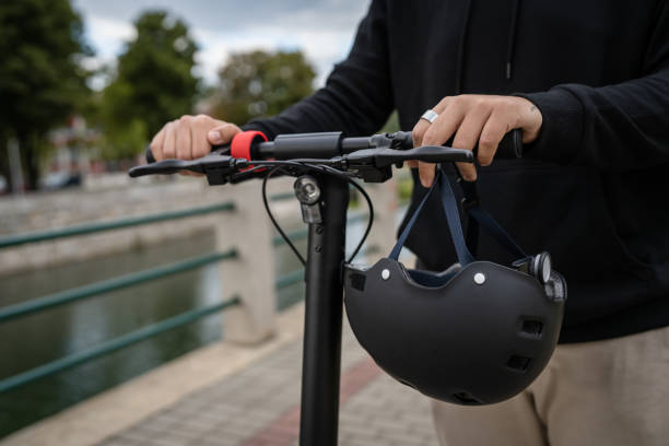 caucasian man drive or ride electric kick scooter e-scooter
