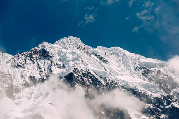 istock Snow caps and clouds a top mt salkantay 1423223107