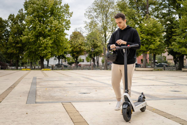istock caucasian man drive or ride electric kick scooter e-scooter 1423224429