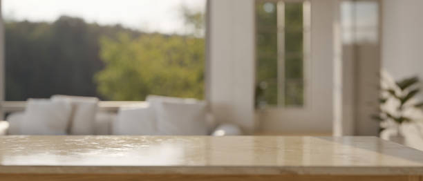 istock Empty mockup space for montage on tabletop over blurred comfortable living room in background 1423227597