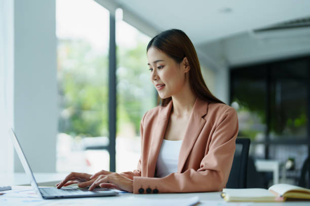 istock Portrait of a beautiful young woman working on a computer. 1423227648