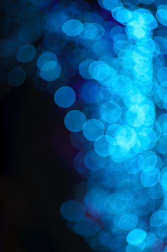 Blue bokeh background in vertical layout with copy space