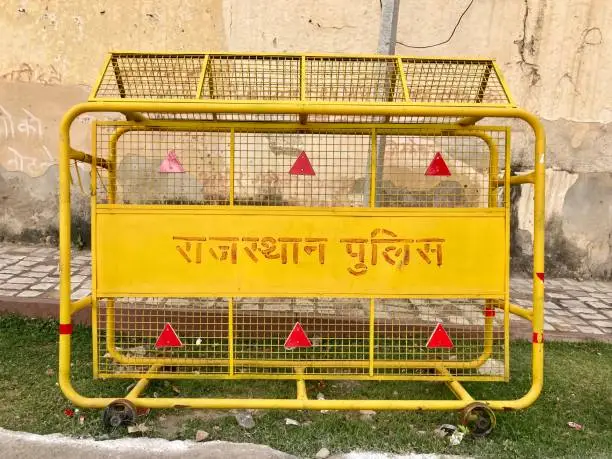 Photo of Jaipur, Rajasthan  India - November 6, 2021: yellow police barricade of the Rajasthan Police