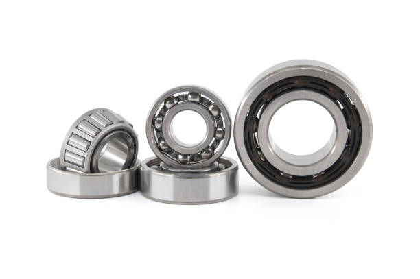 Set of various ball and roller bearings on white stock photo