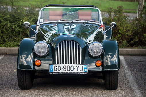 Mulhouse - France - 11 September 2022 - front view of vintage morgan convertible car parked in the street