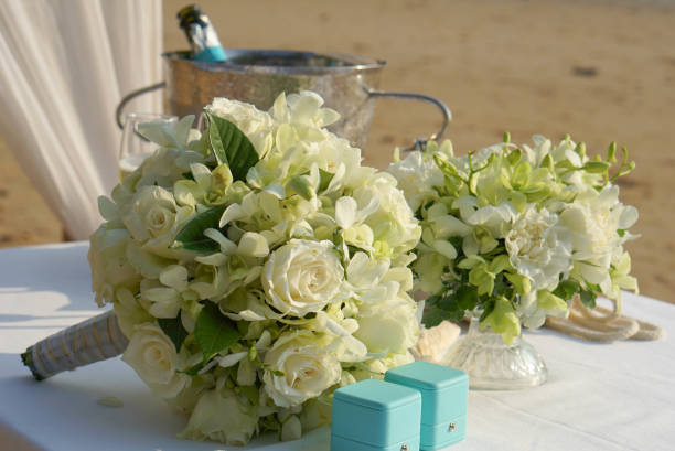 istock White rose and orchid wedding flower bouquet 1423245734