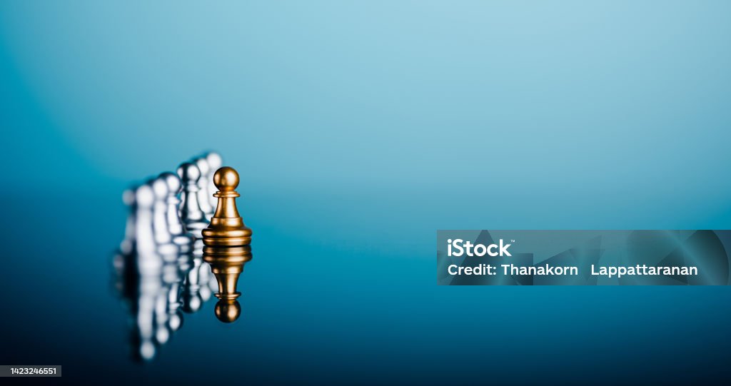 Creative leadership and differentiated business ideas Developing an organizational strategy towards innovation The chess pieces are laid out on the ground and are distinguished by color. Skill Stock Photo
