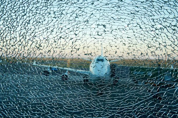 Aircraft silhouette view over the cracked window in the airport Aircraft silhouette view over the cracked window in the airport. Catastrophe and crash concept airplane crash photos stock pictures, royalty-free photos & images