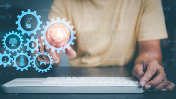 istock Concept to reduce CO2 emissions to alleviate global warming and ecological and climate change,Industrial emissions affecting people and nature,Young man points to icon 1423249507