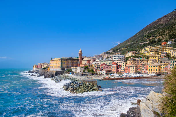 Small harbor in Nervi, Genoa, bordered by colorful buildings - Italy stock photo