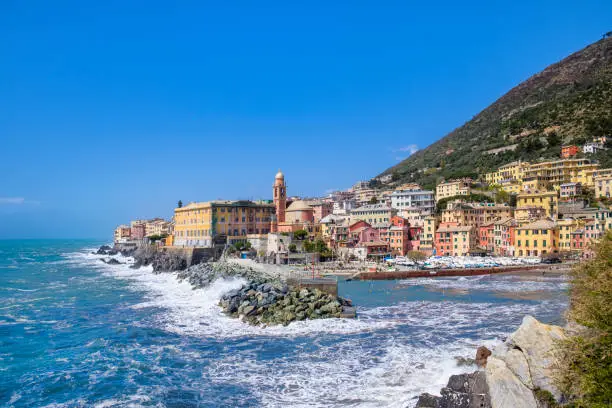 Small harbor bordered by colorful buildings in Nervi, a seaside resort and a quarter of Genoa